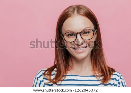 Stok fotoğraf: Close Up Shot Of Good Looking Brown Haired Woman With No Make Up Wears Optical Glasses Has Gentle