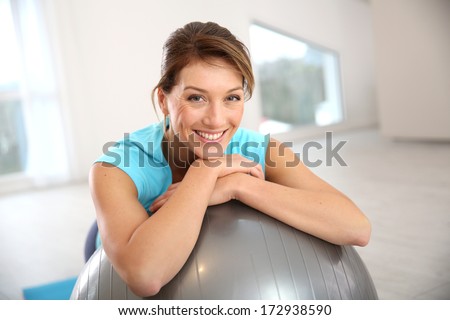 [[stock_photo]]: Portrait Of Fit And Healthy Gym Woman With Ball At Fitness Club