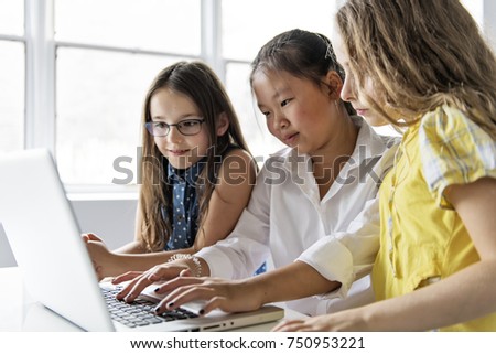 Сток-фото: Group Of Curious Children Watching Stuff On The Laptop Screen