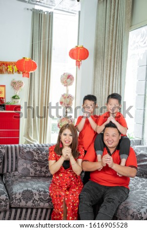 Stockfoto: Mom And Son Celebrate Chinese New Year Look At Chinese Red Lante