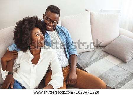 ストックフォト: Cheerful Young Heterosexual Couple Eating Popcorn While Watching Comedy