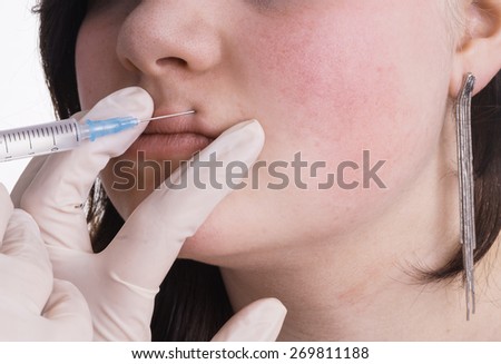 Stok fotoğraf: Young Lady Gets Botox Filler Or Vitamin Injection In The Upper Lip