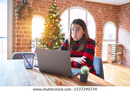 Zdjęcia stock: Amusing Young Female Making Funny Face Using Christmas Lollypops