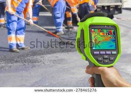 Foto stock: Infrared Thermovision Image Workers On Asphalting Road Street