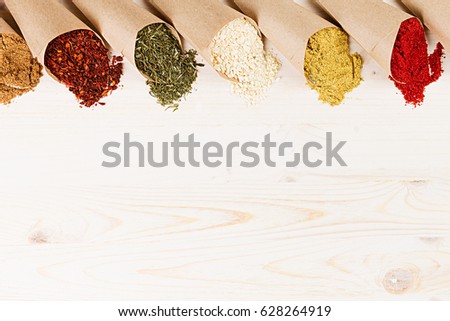 Stock fotó: Varied Powder Spices Close Up On White Wooden Board With Copy Space