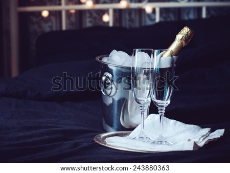 Foto stock: Two Glasses Full Of Sparkling Champagne Wine With Golden Decoration