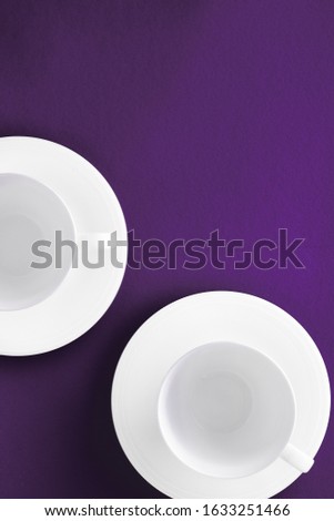 Foto d'archivio: White Tableware Crockery Set Empty Cup On Purple Flatlay Backgr