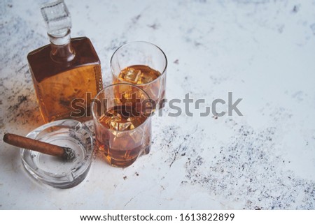 Foto stock: Bottle And Glasses Of Brandy Or Wiskey And Nice Big Cuban Cigar