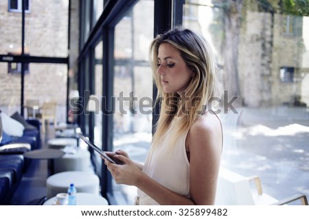 Stok fotoğraf: Portrait Of Pretty Young Woman Holding Touch Screen Tablet Compu
