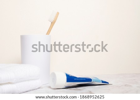 [[stock_photo]]: Tube Of Toothpaste Next To A Toothbrush Against White Background