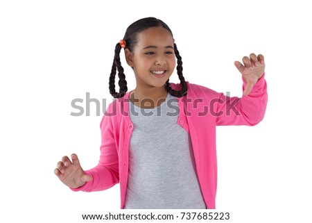 Foto stock: Girl Pretending To Touch An Invisible Screen Against White Background