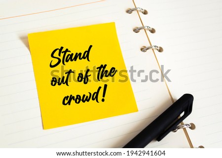 Foto stock: Be Different Stand Out Text On Yellow Sticky Note