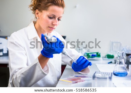 Foto stock: Portrait Of A Female Researcher Carrying Out Research In A Chemi