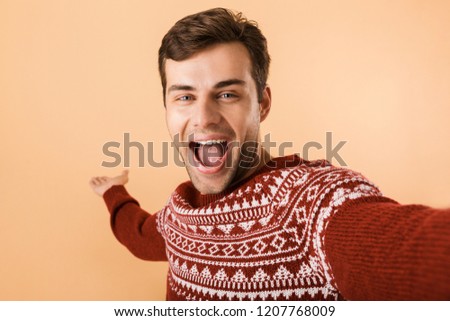 Stockfoto: Image Of Handsome Man 20s With Stubble Wearing Knitted Sweater U