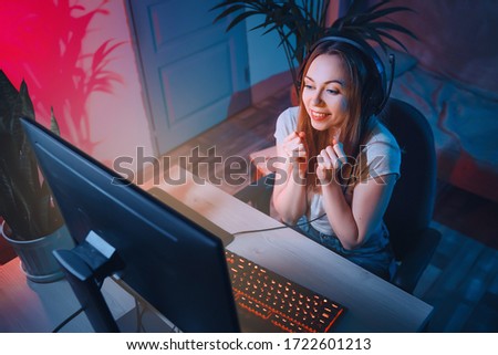 Zdjęcia stock: Joyful Young Woman Playing Computer Games With Virtual Reality G