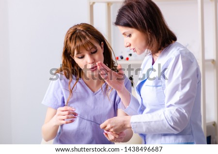 [[stock_photo]]: The Female Doctor Checking Patients Joint Flexibility With Goniometer