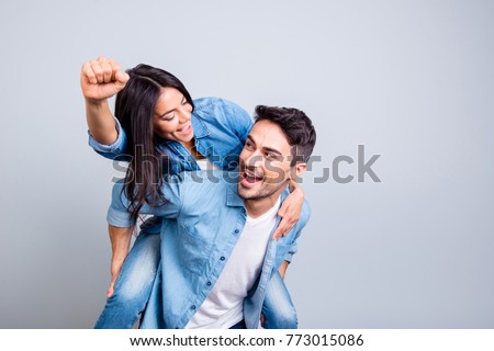 Foto stock: Photo Of Excited Young Woman Smiling And Making Winner Gesture