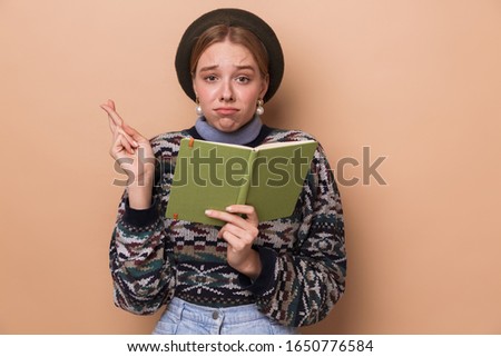 Сток-фото: Photo Of Pretty Displeased Woman Holding Diary And Fingers Crossed