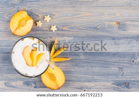 Stok fotoğraf: Colorful Cheerful Breakfast With Yogurt Stars Cornflakes Ripe Slice Peach On Blue Wood Board Decor