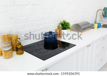 Zdjęcia stock: Modern Kitchen At Home With Kitchenware And Flowerpot On A Top And Wall Tiles In A Trend Color Of Th