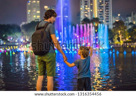 Stock photo: Lake In The Evening Near By Twin Towers With City On Background