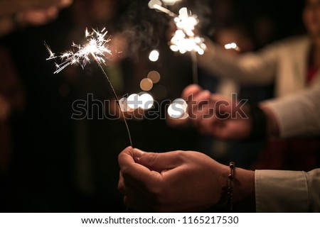 Stock fotó: Wedding Guests During The Evening Wedding Ceremony Holding Sparklers