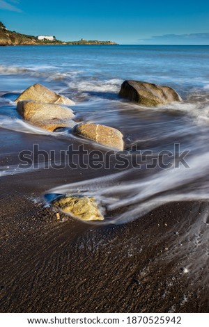 Foto stock: Beautiful Long Exposure Landscape Of Waves Receding With Pier In