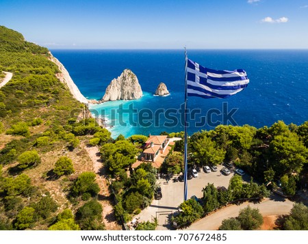 Foto stock: Greek Biggest National Flag Waving In The Sky In Keri In Zakynth