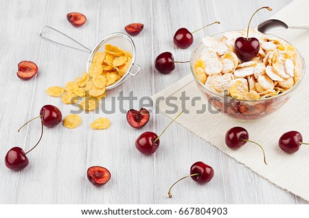 Foto stock: Cooking Breakfast With Golden Corn Flakes Ripe Cherries Powdered Sugar On White Wood Board Top Vie