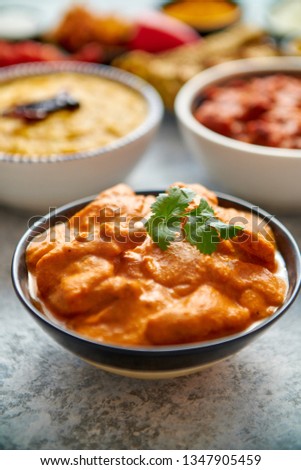 Foto stock: Various Indian Dishes On A Table Mild Butter Chicken In Caramic Bowl