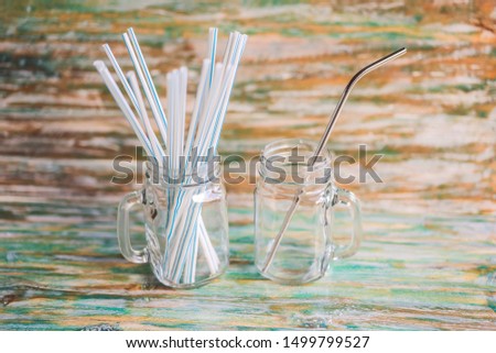 ストックフォト: Steel Drinking Vs Disposable Straws On Painted Wooden Background Zero Waste Concept