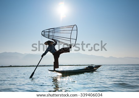 Stock fotó: Burmese Fisherman Catching Fish In Traditional Way Inle Lake Myanmar