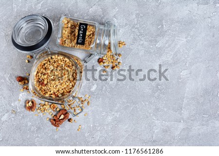 Foto d'archivio: Healthy Breakfast Organic Oat Flakes In A Glass Jar Grey Textile Background