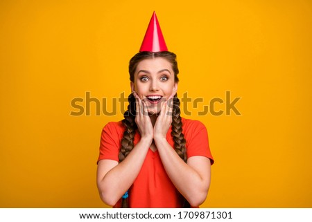 Foto stock: Girl With Red Pigtails On A Yellow Background A Beautiful Girl Is Standing With Her Leg Bent At The