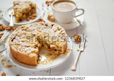 Stockfoto: Whole Delicious Apple Cake With Almonds Served On Wooden Table