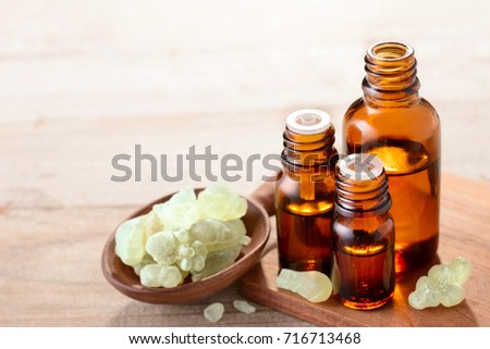 Сток-фото: A Bottle Of Frankincense Essential Oil With Frankincense Resin Crystals