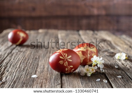 Foto stock: Easter Eggs Dyed With Onion Peels With A Pattern Of Fresh Herbs