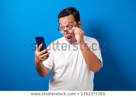 Foto stock: Shocked By The Good News He Reads On The Phone