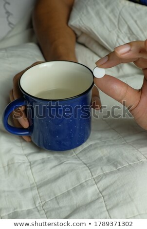 Stock fotó: Man In Bed About To Take A Blue Pill