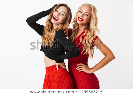 ストックフォト: Portrait Of Two Cheerful Young Smartly Dressed Women