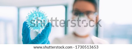 Foto d'archivio: Covid 19 Vaccine Research Worker Looking At Coronavirus In Lab Looking For A Cure Banner Panoramic B