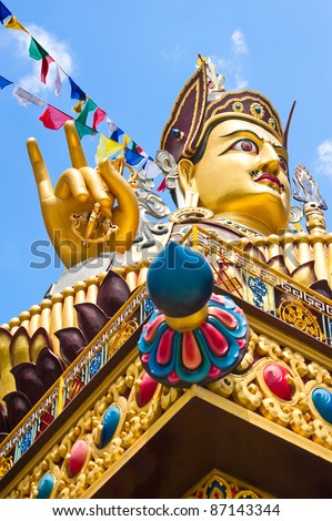 Foto stock: Golden Buddha Sculpture In Tibetan Monastery Focus On Hand Bla