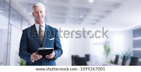 Portrait Of Confident Businessman At His Office Standing Near Em Foto stock © dotshock