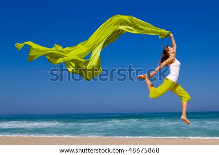 Stock photo: Young Woman Jumping On A Beach