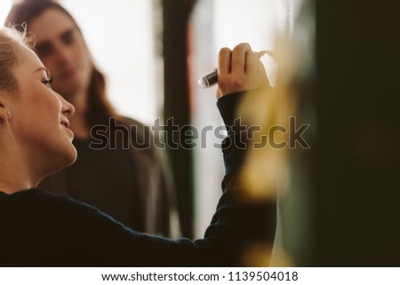 [[stock_photo]]: Close Up Of Two Concentrated Teenagers Studying In The Cafeteria