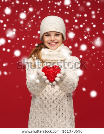 Stok fotoğraf: Girl In Winter Clothes Giving Heart Concept Of Valentines Day