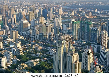 Stok fotoğraf: View Across Bangkok Skyline Showing Office Blocks And Condominiu