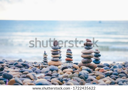 ストックフォト: Stacked Beach Stones At Blue Sea