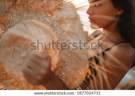 Foto stock: Young Blonde Woman In Black Swimsuit Posing With Hand On Waist And Looking Away Healthy Lifestyle C