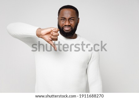 Foto stock: Portrait Of Sad African American Guy Wearing Sweater And Scarf G